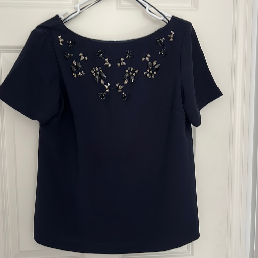 Navy blue top with jewel accents
